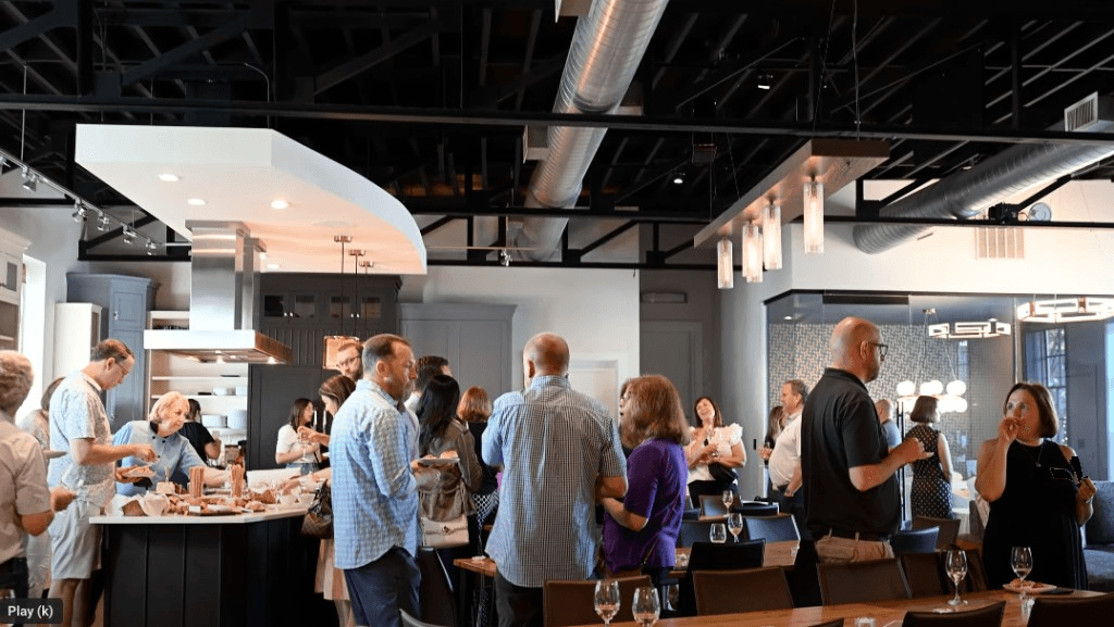 Guests gathering and sharing a meal in the main room